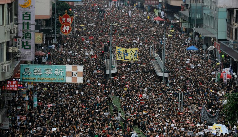 Tens of thousands of protesters march through the streets as they continue to protest an extradition bill, Sunday, June 16, 2019, in Hong Kong. Hong Kong residents were gathering Sunday for another massive protest over an unpopular extradition bill that has highlighted the territory's apprehension about relations with mainland China, a week after the crisis brought as many as 1 million into the streets. 