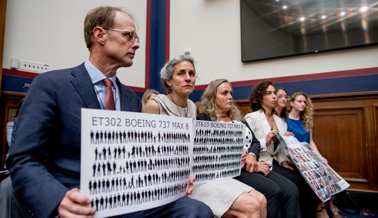 Michael Stumo and his wife Nadia Milleron, the parents of Samya Rose Stumo, hold up signs depicting those lost in Ethiopian Airlines Flight 302 and Lion Air Flight 610 during a House Committee on Transportation and Infrastructure hearing on the status of the Boeing 737 MAX on Capitol Hill in Washington.