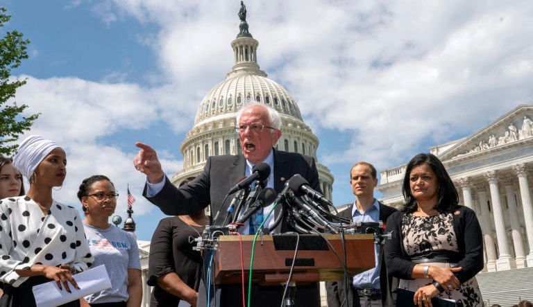 Democratic presidential candidate, Sen. Bernie Sanders, I-Vt., flanked by Rep. Ilhan Omar, D-Minn., left, and Rep. Pramila Jayapal, D-Wash., right, calls for legislation to cancel all student debt, at the Capitol in Washington, Monday, June 24, 2019.