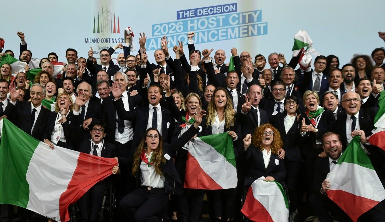 Members of the Milan-Cortina delegation celebrate after winning the bid to host the 2026 Winter Olympic Games during the first day of the 134th Session of the International Olympic Committee at the SwissTech Convention Centre in Lausanne, Switzerland.
