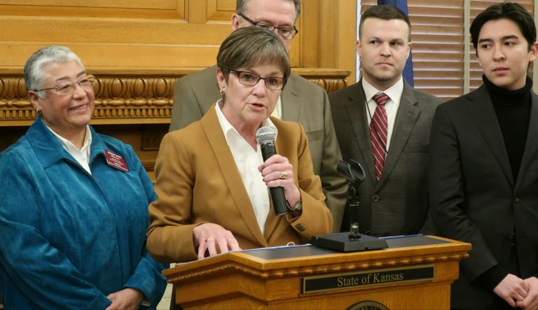 In this Tuesday, Jan. 15, 2019 photo, Kansas Gov. Laura Kelly answers questions about her executive order to ban anti-LGBTQ discrimination in state hiring and employment decisions during a news conference at the Statehouse in Topeka, Kansas. Kelly's administration will allow transgender people to change their birth certificates as part of a settlement to end a federal lawsuit. 