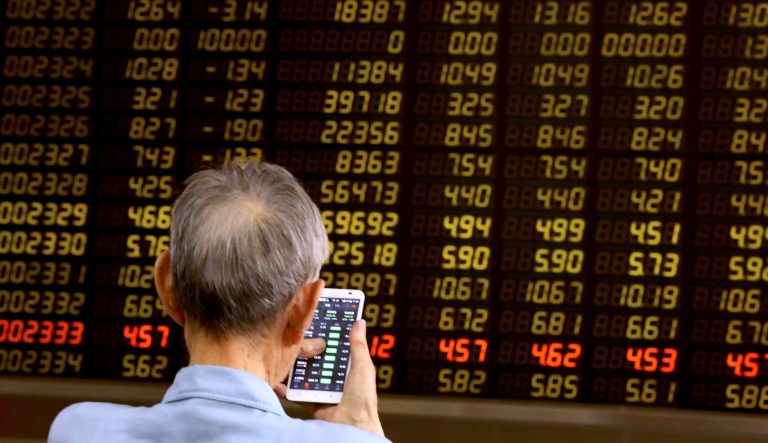 A man monitors stock prices at a brokerage in Beijing on Tuesday, June 25, 2019. Major Asian stock markets declined Tuesday as traders looked ahead to a meeting between the American and Chinese presidents amid hopes for renewed trade talks. 