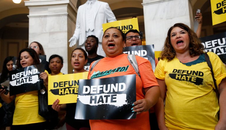 Protesters gather to demand the defunding of government agencies for border protection and customs enforcement, Tuesday, June 25, 2019, on Capitol Hill in Washington. 