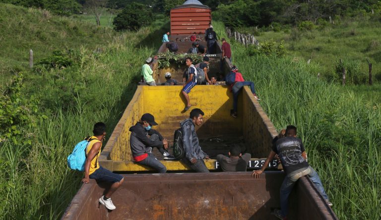 Honduran migrants ride a freight train on their way north, in Salto del Agua, Chiapas state, Mexico, Tuesday, June 25, 2019. 
