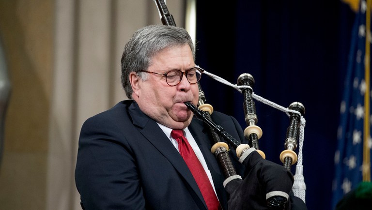 Attorney General William Barr surprises the audience by playing his bagpipes.