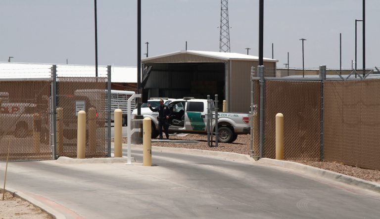 A Customs and Border Patrol officer guards the entrance to the Border Patrol station in Clint, Texas, Wednesday, June 26, 2019. The facility has been a hub for detained children in border patrol custody in New Mexico and West Texas since 2014. 