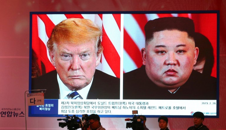 A screen in Seoul, South Korea, shows North Korean leader Kim Jong Un, right, and President Trump.