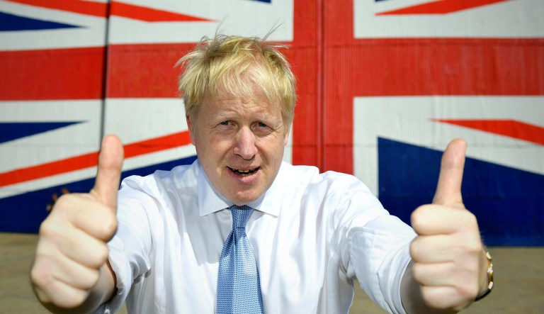 Boris Johnson gives two thumbs up at the Wight Shipyard Company at Venture Quay during a visit to the Isle of Wight, England.