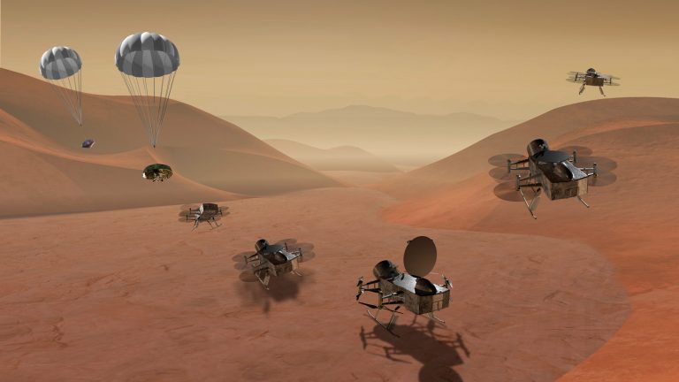 This artist's rendering made available by NASA shows multiple views of the Dragonfly dual-quadcopter lander that would take advantage of the atmosphere on Saturn's moon Titan.