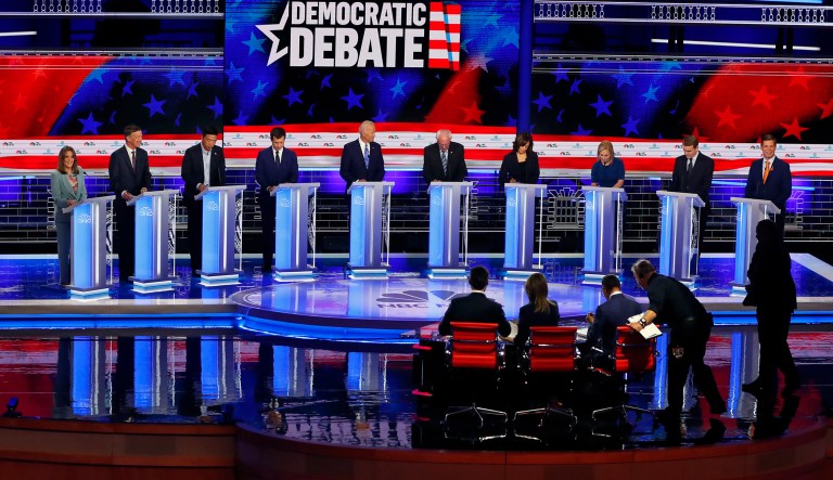 Democratic presidential candidates, author Marianne Williamson, former Colorado Gov. John Hickenlooper, entrepreneur Andrew Yang, South Bend Mayor Pete Buttigieg, former Vice President Joe Biden, Sen. Bernie Sanders, I-Vt., Sen. Kamala Harris, D-Calif., Sen. Kirsten Gillibrand, D-N.Y., Colorado Sen. Michael Bennet, and Rep. Eric Swalwell, D-Calif., listen to a question during a Democratic primary debate hosted by NBC News at the Adrienne Arsht Center for the Performing Arts in Miami.