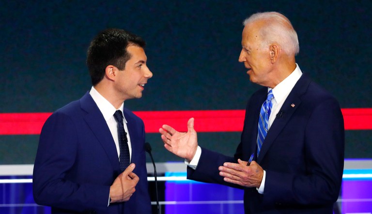 Democratic presidential candidate former Vice President Joe Biden speaks to South Bend, Indiana, Mayor Pete Buttigieg during a break in the Democratic primary debate hosted by NBC News at the Adrienne Arsht Center for the Performing Arts in Miami. 