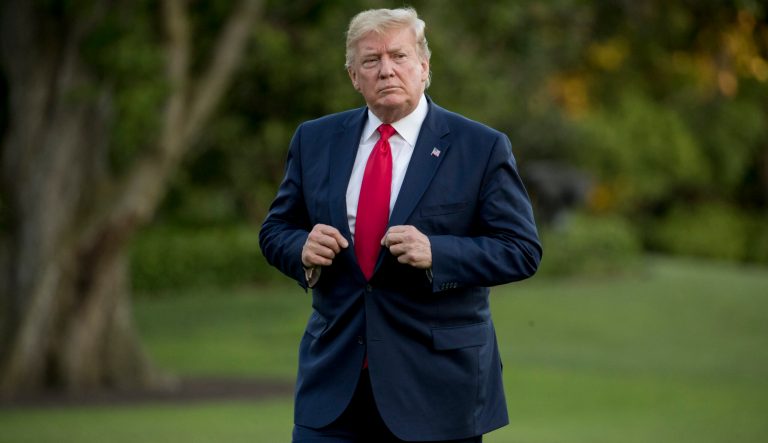 President Donald Trump walks across the South Lawn as he arrives at the White House, Sunday, June 30, 2019, in Washington. 