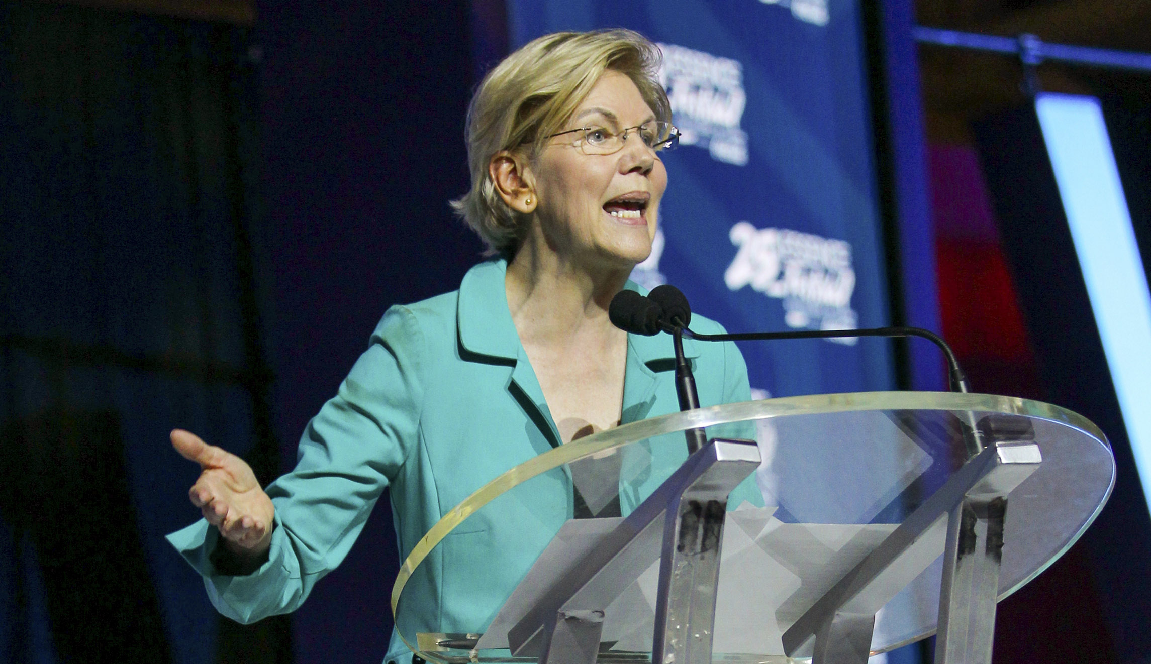 Warren interrupted by protesters clamoring for legalization of illegal immigrants