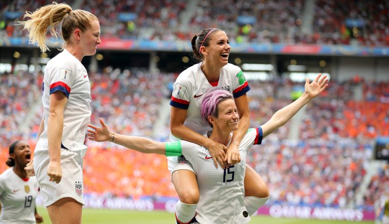 United States' Megan Rapinoe (15) and teammates celebrate after Rapinoe scored the opening goal from the penalty spot during the Women's World Cup final soccer match between U.S. and The Netherlands at the Stade de Lyon in Decines, outside Lyon, France, Sunday, July 7, 2019. 