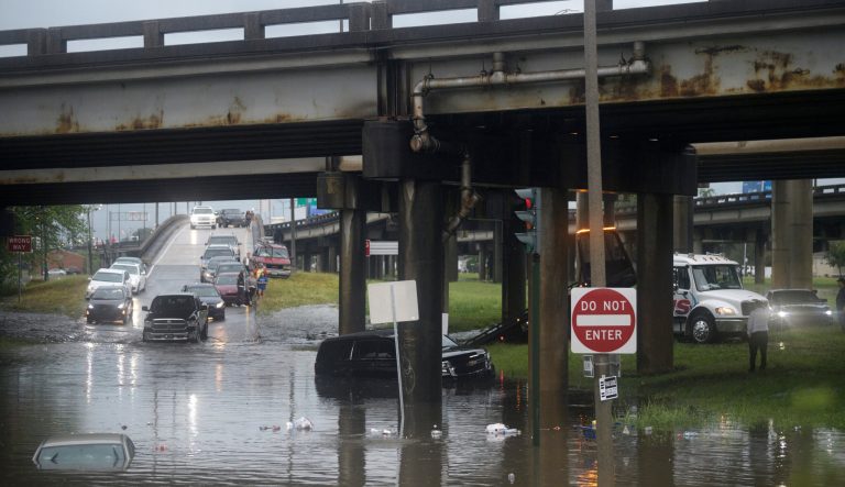 Motorist try to maneuver around flooding at the intersection of Franklin Ave. and 610 following heavy rain, Wednesday, July 10, 2019, in New Orleans. 
