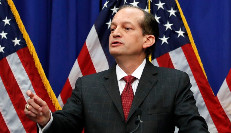 Labor Secretary Alex Acosta calls on a reporter to ask a question during a news conference at the Department of Labor in Washington. 