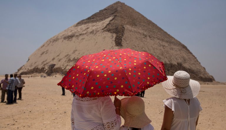 Women visit the Bent Pyramid during an during an event opening the pyramid and its satellites for visitors in Dashur, Egypt, Saturday, July 13, 2019. 