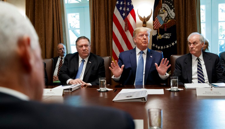 President Trump speaks during a Cabinet meeting in the Cabinet Room of the White House in Washington. Trump is accompanied by Secretary of State Mike Pompeo, left, and acting Defense Secretary Richard Spencer. 