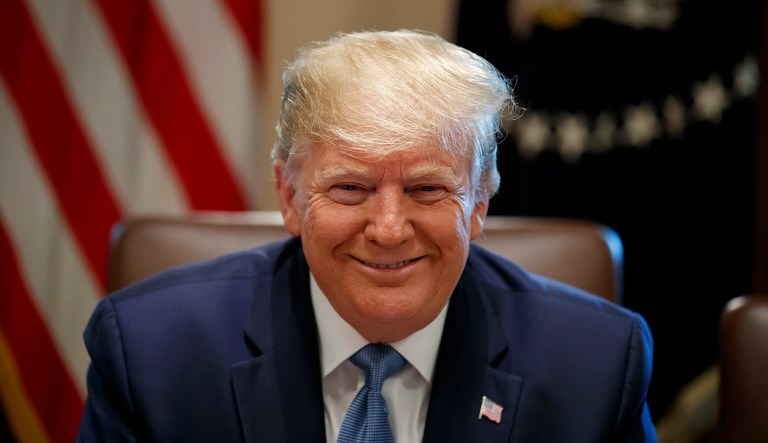 President Donald Trump smiles during a Cabinet meeting in the Cabinet Room of the White House, Tuesday, July 16, 2019, in Washington. 