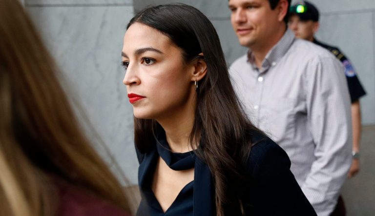 Rep. Alexandria Ocasio-Cortez, D-N.Y., walks out of a House of Representatives office building, Tuesday, July 16, 2019, on Capitol Hill in Washington. 
