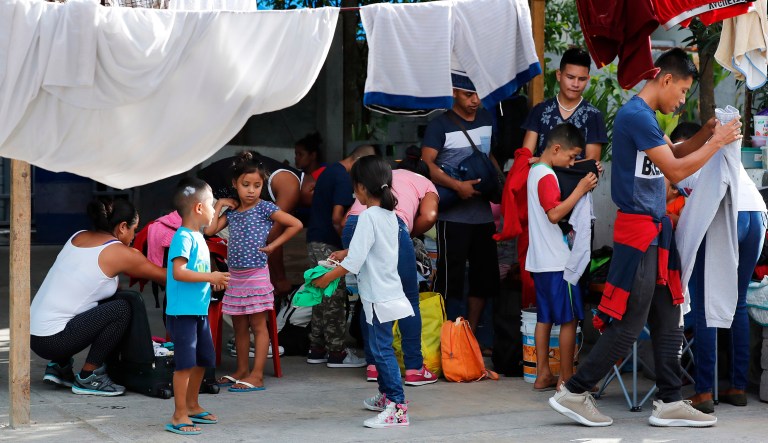 Migrants pack their bags as they wait to be taken to the U.S. border to apply for asylum, at the AMAR migrant shelter in Nuevo Laredo, Mexico.