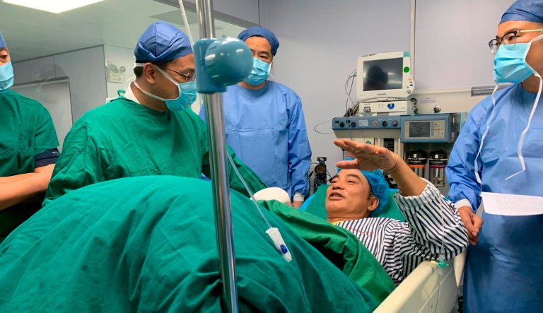 In this photo taken July 20, 2019 and released by Emperor Entertainment Group, veteran Hong Kong actor Simon Yam receives hospital treatment after being stabbed, in the city of Zhongshan in Guangdong province, Hong Kong. 