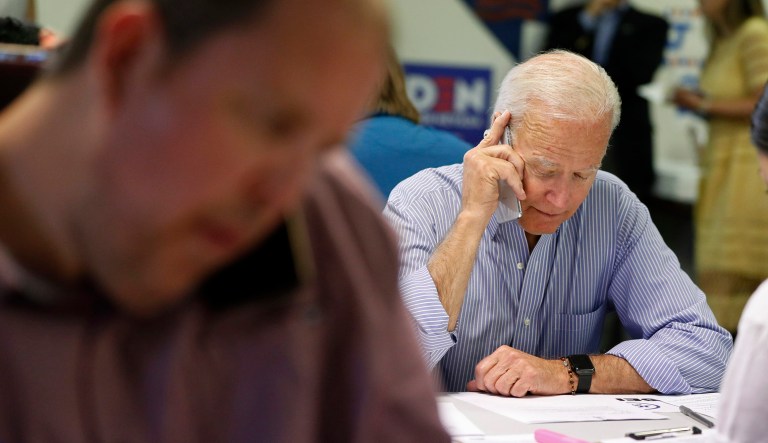 Former vice president and Democratic presidential candidate Joe Biden calls during a campaign phone bank event an electrical workers union hall in Las Vegas.