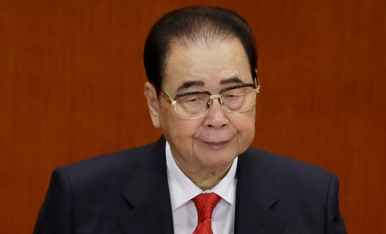 In this Nov. 8, 2012 photo, former Chinese Premier Li Peng attends the opening session of the 18th Communist Party Congress at the Great Hall of the People in Beijing. Li Peng, a former hard-line Chinese premier best known for announcing martial law during the 1989 Tiananmen Square pro-democracy protests, has died. He was 90. 