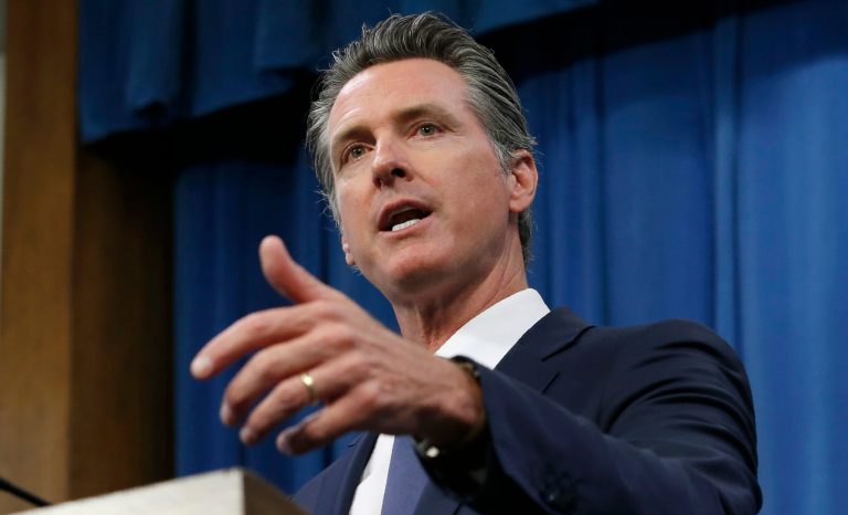 Gov. Gavin Newsom discusses a report detailing the efforts by the DMV to improve customer services during a news conference in Sacramento, Calif., Tuesday, July 23, 2019. 