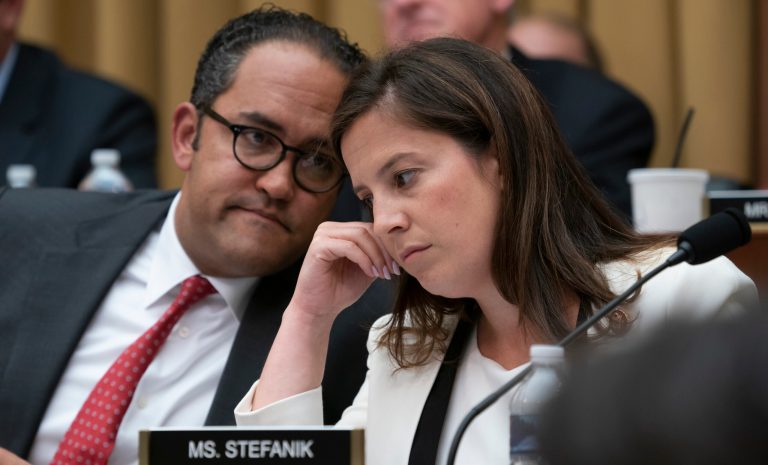 Rep. Will Hurd, R-Texas, left, and Rep. Elise Stefanik, R-N.Y., talk as former special counsel Robert Mueller testifies to the House Intelligence Committee about his investigation into Russian interference in the 2016 election, on Capitol Hill in Washington, Wednesday, July 24, 2019.  