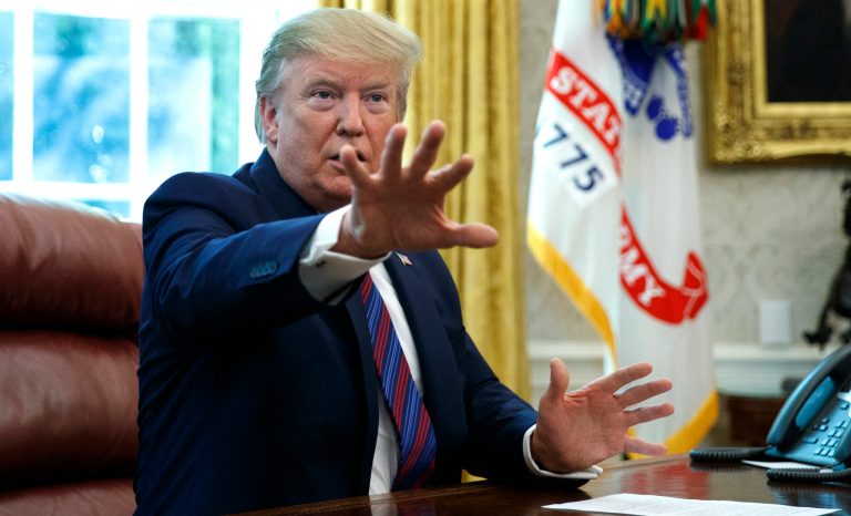 President Donald Trump speaks in the Oval Office of the White House in Washington, Friday, July 26, 2019. Trump announced that Guatemala is signing an agreement to restrict asylum applications to the U.S. from Central America.