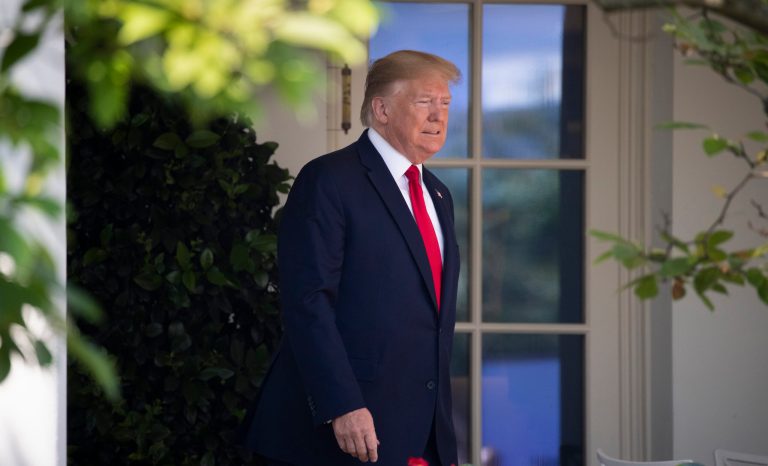 President Trump arrives in the Rose Garden of the White House, Monday, July 29, 2019, in Washington. 