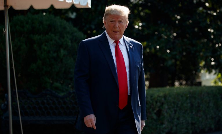 President Donald Trump walks over to speak with reporters before departing for an event to celebrate the 400th anniversary celebration of the first representative assembly at Jamestown, on the South Lawn of the White House, Tuesday, July 30, 2019, in Washington. 