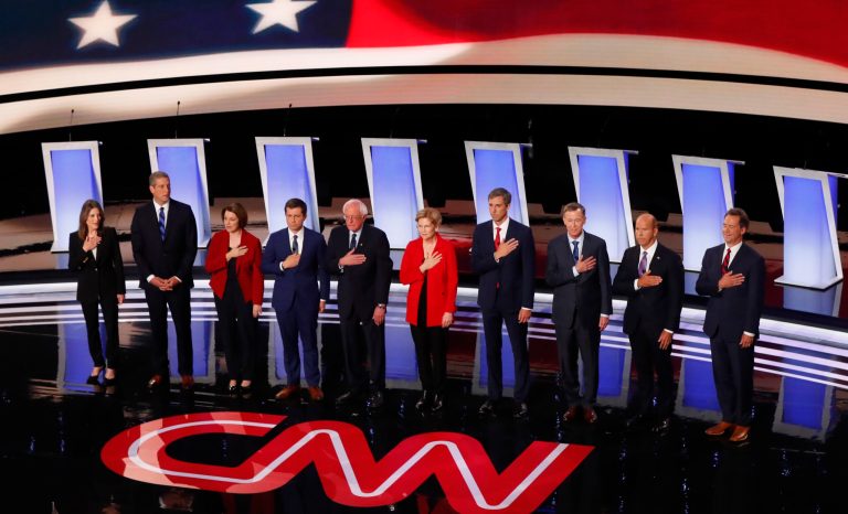 From left, Marianne Williamson, Rep. Tim Ryan, D-Ohio, Sen. Amy Klobuchar, D-Minn., South Bend Mayor Pete Buttigieg, Sen. Bernie Sanders, I-Vt., Sen. Elizabeth Warren, D-Mass., former Texas Rep. Beto O'Rourke, former Colorado Gov. John Hickenlooper, former Maryland Rep. John Delaney and Montana Gov. Steve Bullock take the stage for the first of two Democratic presidential primary debates hosted by CNN Tuesday, July 30, 2019, in the Fox Theatre in Detroit. 