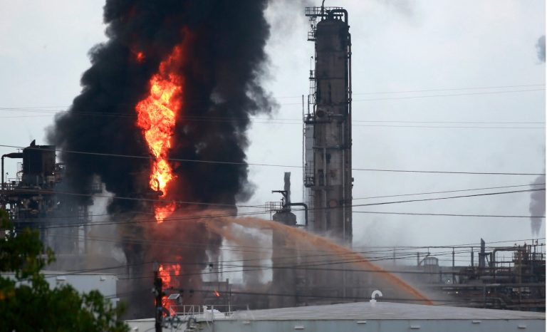 Flames and smoke rise after a fire started at an Exxon Mobil facility, Wednesday, July 31, 2019, in Baytown, Texas. 