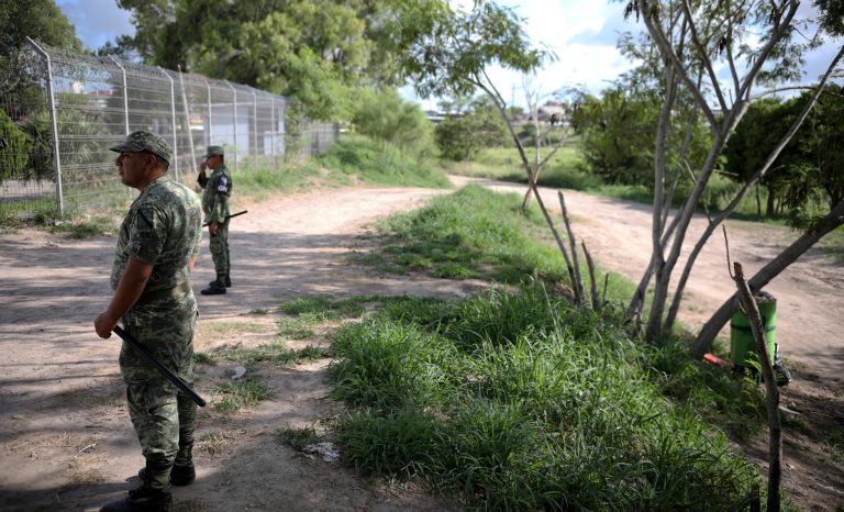 Military police wearing the insignia of the National Guard patrol near the border bridge that crosses the Rio Grande river in Matamoros, Mexico, Thursday, Aug. 1, 2019, on the border with Brownsville, Texas.