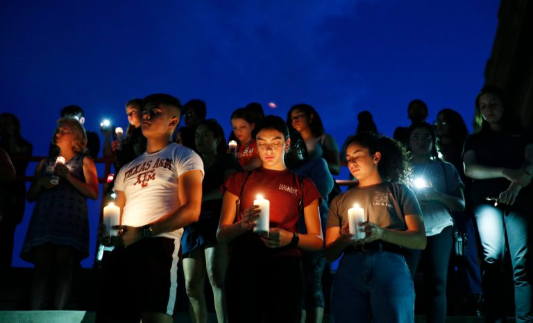From left, Samuel Lerma, Arzetta Hodges and Desiree Quintanar attend a vigil for victims of the deadly shooting that occurred earlier in the day at a shopping center Saturday, Aug. 3, 2019, in El Paso, Texas. 