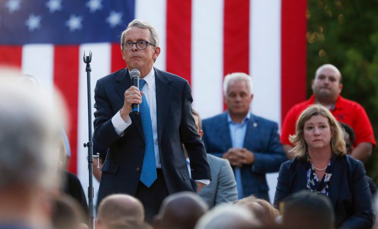 Ohio Gov. Mike DeWine, left, speaks alongside Dayton Mayor Nan Whaley, right, during a vigil at the scene of a mass shooting, Sunday, Aug. 4, 2019, in Dayton, Ohio. 