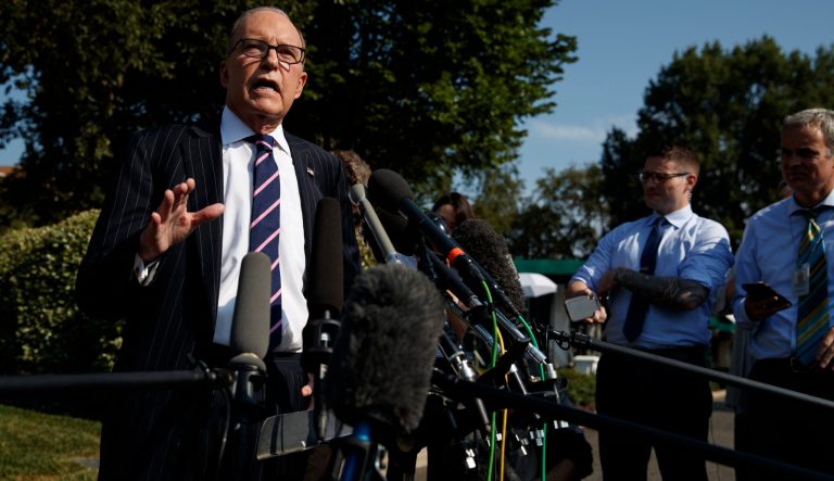 White House chief economic adviser Larry Kudlow talks with reporters outside the White House, Tuesday, Aug. 6, 2019, in Washington. 