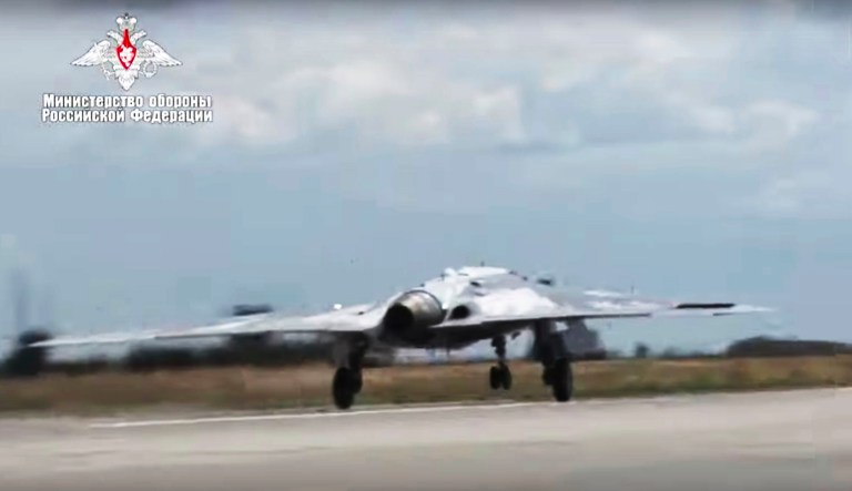 In this video grab made available on Wednesday, Aug. 7, 2019, by the Russian Defense Ministry Press Service, Russia's military drone Okhotnik is seen taking off at an unidentified location in Russia. The ministry said the drone, which has stealth capabilities and is equipped with advanced reconnaissance equipment, made its maiden flight Saturday. 