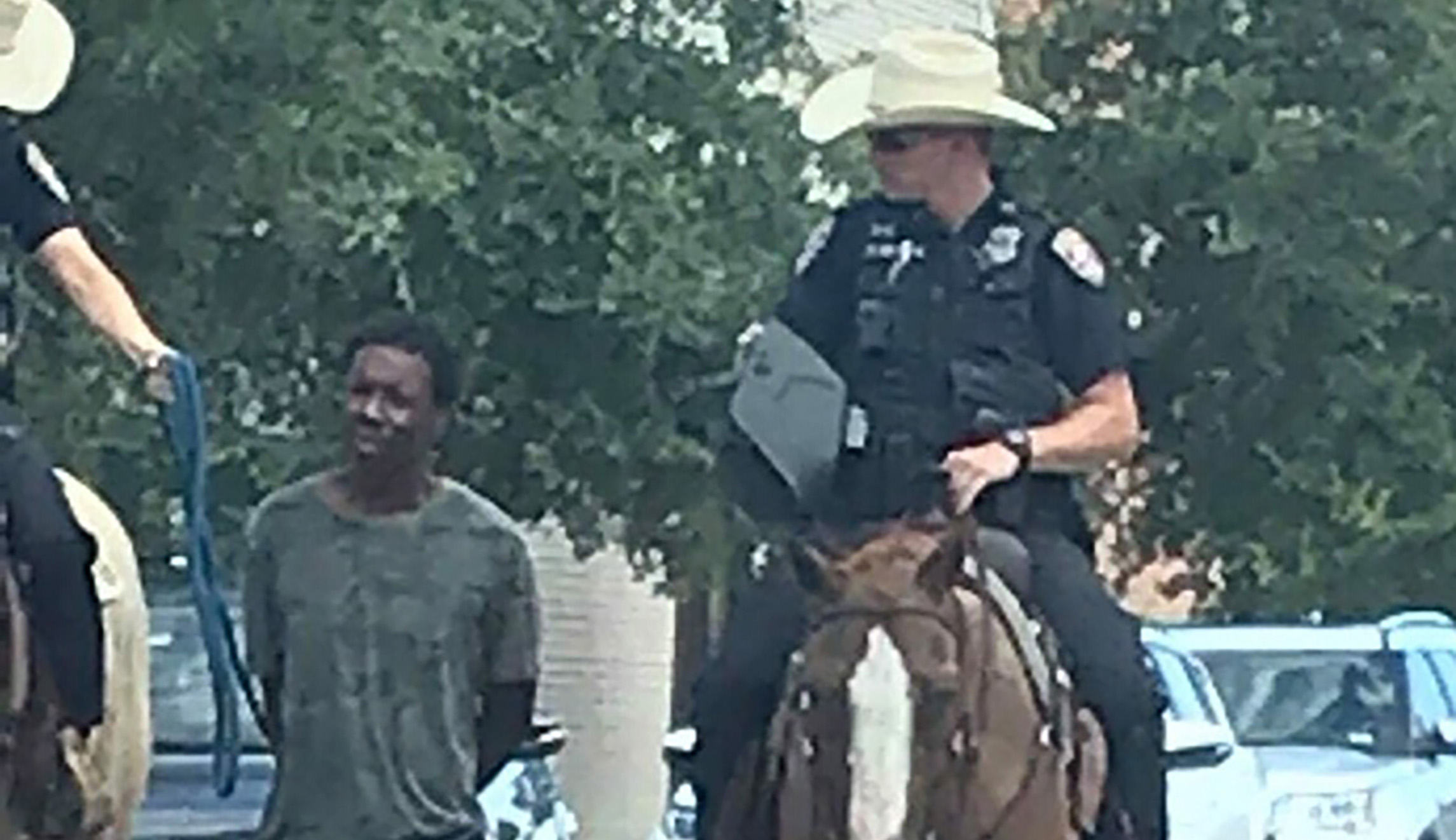 Black man who was led by mounted police with a rope in viral photos files $1M lawsuit against Texas city