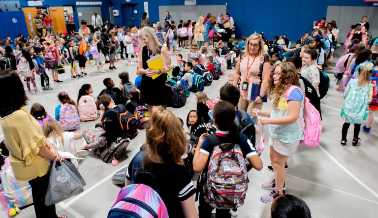Lost River Elementary School students gather with their teachers Wednesday, August 7, 2019, during the first day of school in Bowling Green, Ky.
