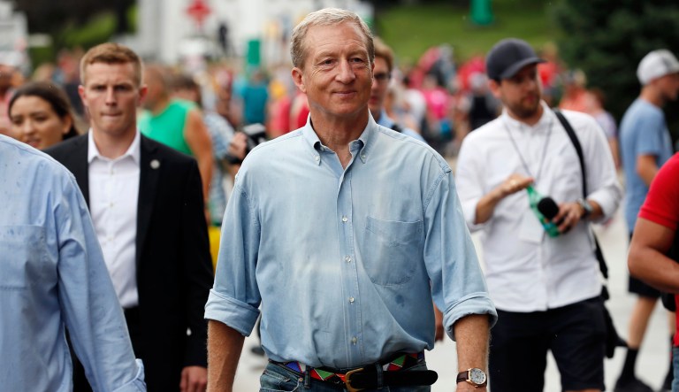 Democratic presidential candidate and businessman Tom Steyer walks down the grand concourse during a visit to the Iowa State Fair in Des Moines, Iowa. 