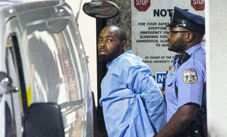 Police take shooting suspect, Maurice Hill, into custody after an hourslong standoff with police, that wounded several police officers, in Philadelphia early Thursday, Aug. 15, 2019. 