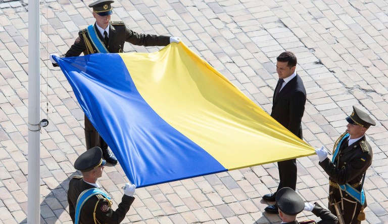 Ukrainian President Volodymyr Zelenskiy, right, attends a ceremony during the National Flag Day celebration at the St. Sophia square in downtown Kyiv, Ukraine, on Friday.