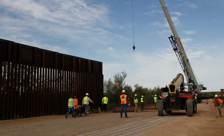 Workers break ground on new border wall construction about 20 miles west of Santa Teresa, New Mexico.
