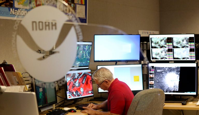 Senior hurricane specialist Stacy Stewart monitors the progress of Tropical Storm Dorian at the National Hurricane Center, Tuesday, Aug. 27, 2019, in Miami. 