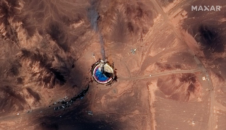 This satellite image from Maxar Technologies shows a fire at a rocket launchpad at the Imam Khomeini Space Center in Iran's Semnan province, Thursday. Satellite images released Thursday show the smoldering remains of a rocket at a Iran space center that was to conduct a U.S.-criticized satellite launch.