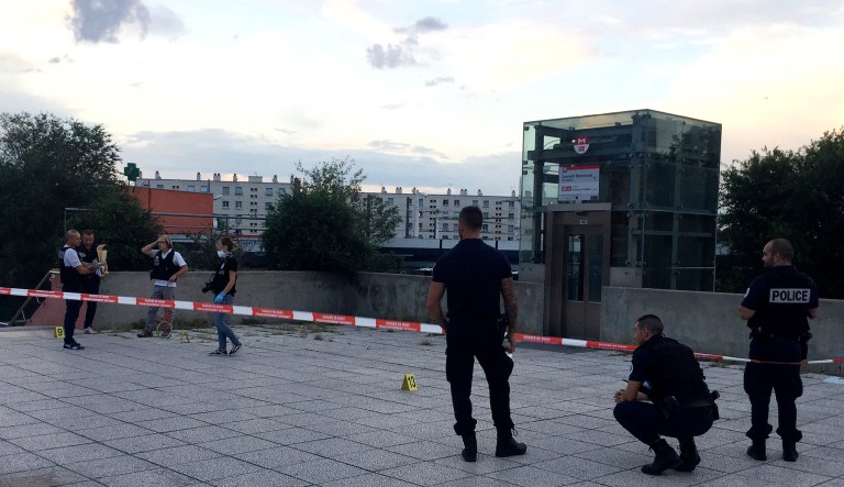 Police officers investigate where an assailant stabbed one person to death and injured nine others and has been arrested on Saturday just outside a subway station in Villeurbanne, outside Lyon, central France. The reason for the attack is unclear. 