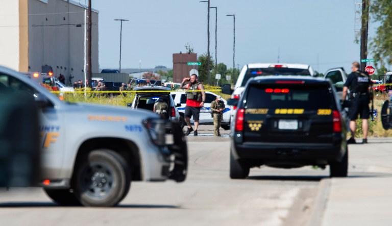 Odessa and Midland police and sheriff's deputies surround the area behind Cinergy in Odessa, Texas, Saturday, after reports of shootings. Police said there are "multiple gunshot victims" in West Texas after reports of gunfire on Saturday in the area of Midland and Odessa. 